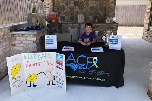 Joshua Bertuglia mans his lemonade stand